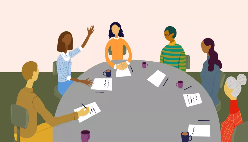 people having a discussion around a table