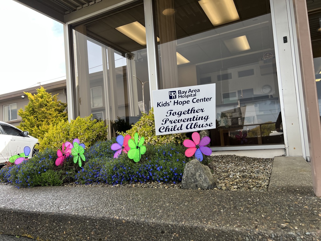 Front of the District Office with pinwheels and Kids Hope Center signage